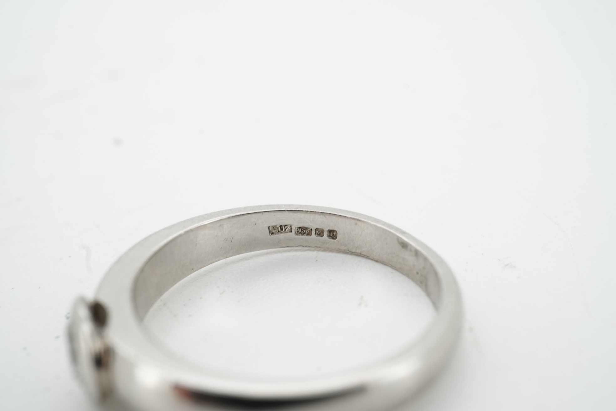 A diamond ring, collet-set with a brilliant-cut diamond weighing approximately 0.52 carats, mounted in platinum, size K1/2, British hallmarks, gross weight approximately 4 grams